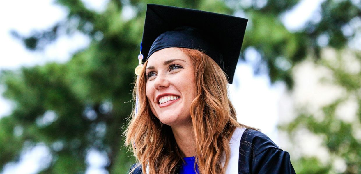 Woman wearing cap and gown